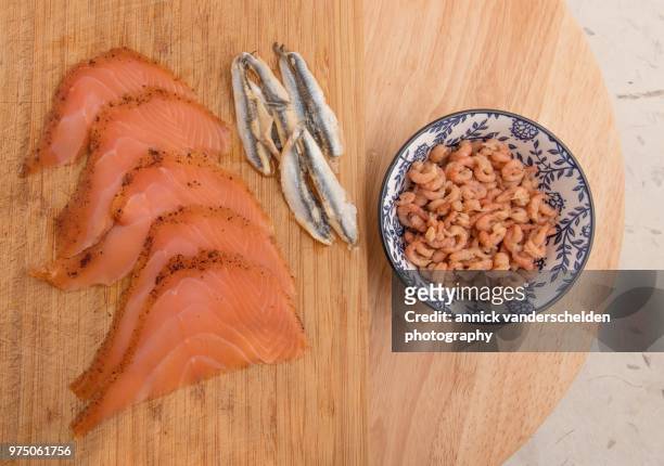 north sea shrimp, salmon and anchovies. - decapoda stock pictures, royalty-free photos & images