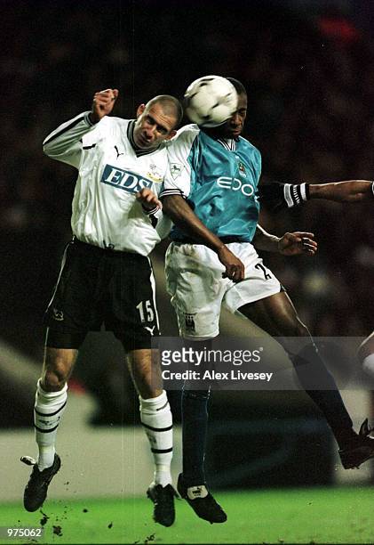Danny Higginbotham of Derby holds off Paolo Wanchope of Man City during the Premier League match between Manchester City and Derby County at Maine...