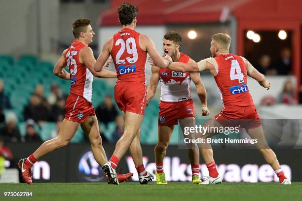 Tom Papley of the Swans celebrates kicking a goal with team mates during the round 13 AFL match between the Sydney Swans and the West Coast Eagles at...