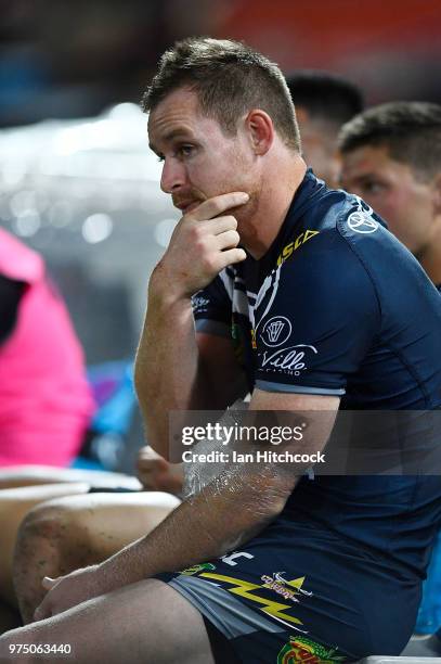 Michael Morgan of the Cowboys sits on the bench after being injured during the round 15 NRL match between the North Queensland Cowboys and the New...