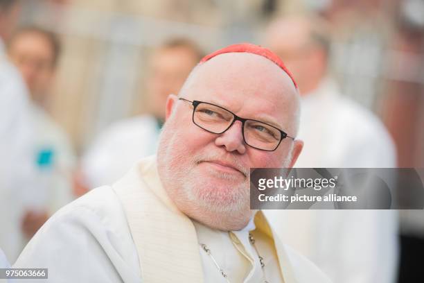 May 2018, Germany, Muenster: Cardinal Reinhard Marx, archbishop of Munich and Freising, taking part at a service in front of the castle for Ascension...