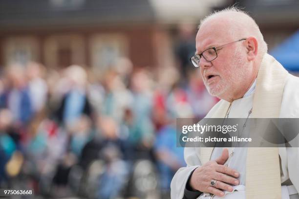 May 2018, Germany, Muenster: Cardinal Reinhard Marx, archbishop of Munich and Freising, taking part at a service in front of the castle for Ascension...