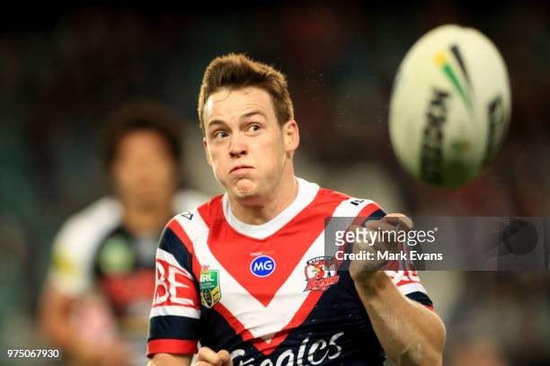 Luke Keary of the Roosters passes the ball during the round 15 NRL match between the Sydney Roosters and the Penrith Panthers at Allianz Stadium on...