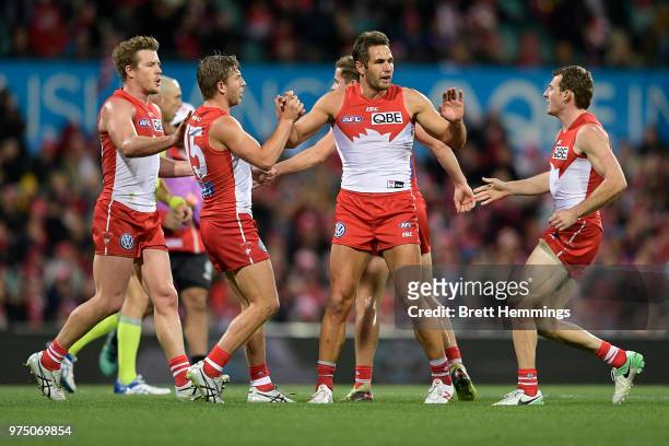 Josh Kennedy of the Swans celebrates kicking a goal with team mates during the round 13 AFL match between the Sydney Swans and the West Coast Eagles...