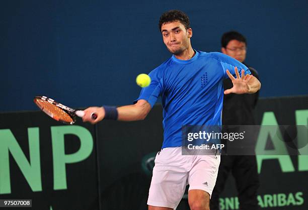 Uzbekistan's Farrukh Dustov returns a shot against China's Wu Di, ranked a lowly 670th in the world, in the final match of the Davis Cup tie in...
