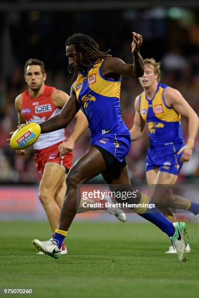 Nic Naitanui of the Eagles runs with the ball during the round 13 AFL match between the Sydney Swans and the West Coast Eagles at Sydney Cricket...