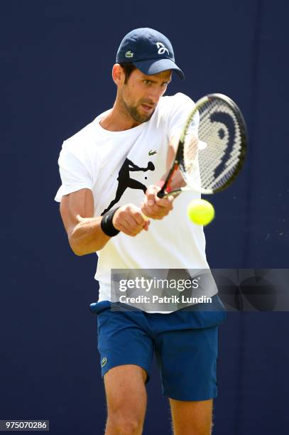 Novak Djokovic of Serbia hits a backhand in practice during preview Day 3 of the Fever-Tree Championships at Queens Club on June 15, 2018 in London,...