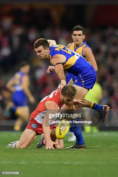 Scott Lycett of the Eagles tackles Kieren Jack of the Swans during the round 13 AFL match between the Sydney Swans and the West Coast Eagles at...