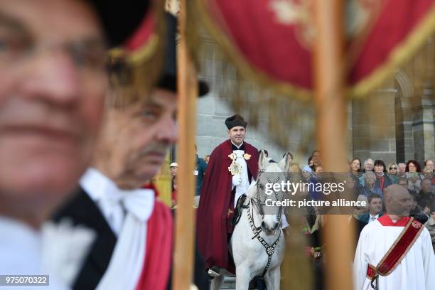 May 2018, Germany, Weingarten: Dean Ekkehard Schmid, the 'Holy Blood Rider', participates in the traditional 'blood ride' to celebrate Ascension Day...