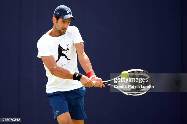 Novak Djokovic of Serbia hits a backhand in practice during preview Day 3 of the Fever-Tree Championships at Queens Club on June 15, 2018 in London,...