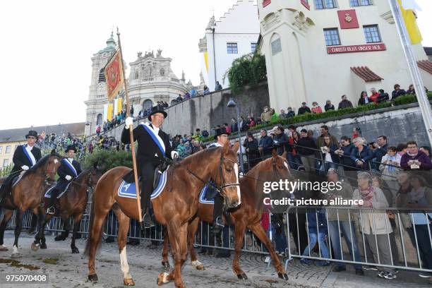 May 2018, Germany, Weingarten: Participants in the traditional 'blood ride' carry the black ribbon to celebrate Ascension Day in Europe's largest...