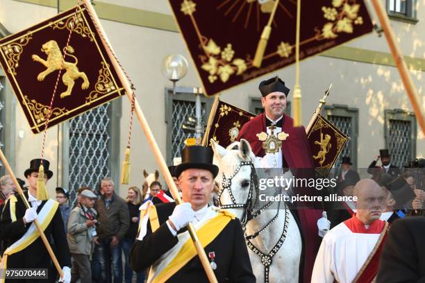 May 2018, Germany, Weingarten: Dean Ekkehard Schmid, the 'Holy Blood Rider', participates in the traditional 'blood ride' to celebrate Ascension Day...