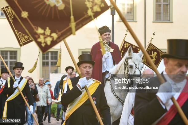 May 2018, Germany, Weingarten: Dean Ekkehard Schmid, the 'Holy Blood Rider', participates in the traditional 'blood ride' to celebrate Ascension Day...
