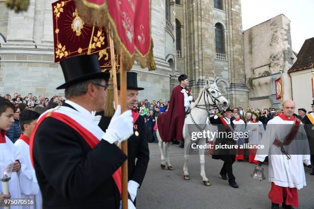 May 2018, Germany, Weingarten: Dean Ekkehard Schmid, the 'Holy Blood Rider', participates in the traditional 'blood ride' to celebrate Ascension Day...