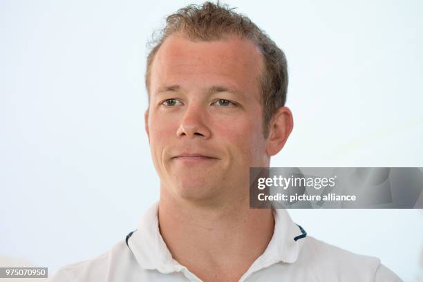 May 2018, Germany, Wiesbaden: Gymnast and Olympic medallist Fabian Hambuechen visits a waste removal business, where a project is launched to help...