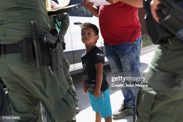 Boy and father from Honduras are taken into custody by U.S. Border Patrol agents near the U.S.-Mexico Border on June 12, 2018 near Mission, Texas....