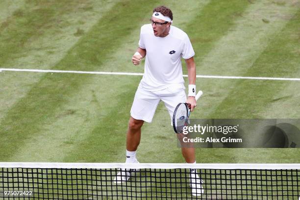 Denis Istomin of Uzbekistan celebrates during his match against Lucas Pouille of France during day 5 of the Mercedes Cup at Tennisclub Weissenhof on...