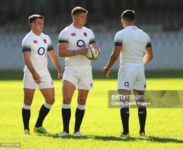 George Ford, Owen Farrell and Ben Youngs gather during the England training session at Kings Park Stadium on June 15, 2018 in Durban, South Africa.