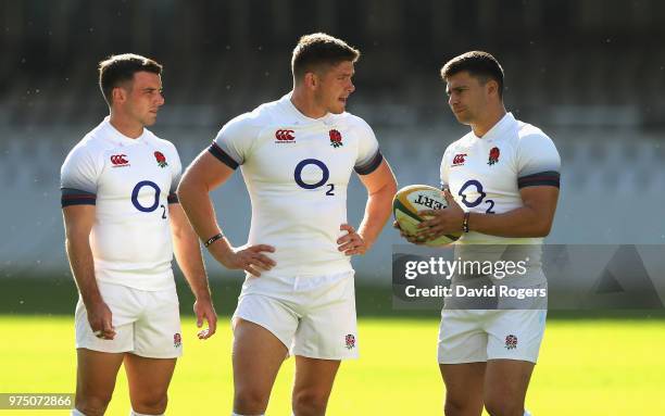 George Ford, Owen Farrell and Ben Youngs gather during the England training session at Kings Park Stadium on June 15, 2018 in Durban, South Africa.