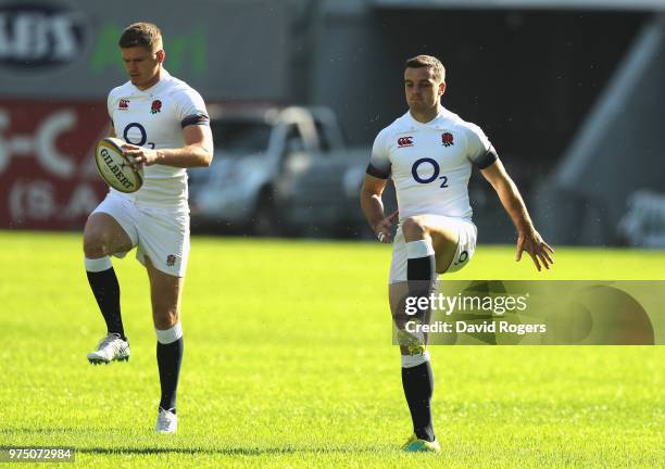 Owen Farrell the England captain and George Ford warm up during the England training session at Kings Park Stadium on June 15, 2018 in Durban, South...