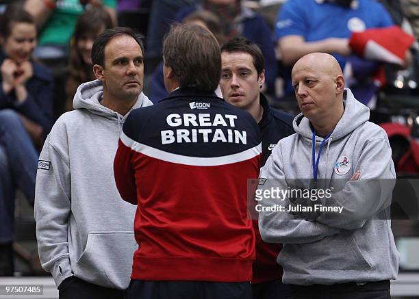 Great Britain captain John Lloyd speaks with LTA coach Paul Annacone , physio Rob Hill and player director Steve Martens after James Ward of Great...