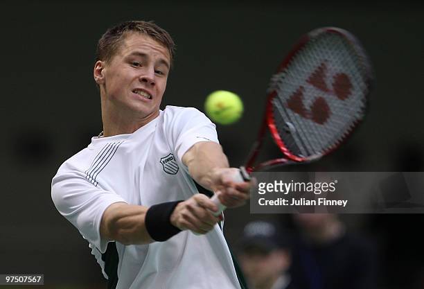 Ricardas Berankis of Lithuania plays a backhand in his match against James Ward of Great Britain during day three of the Davis Cup Tennis match...