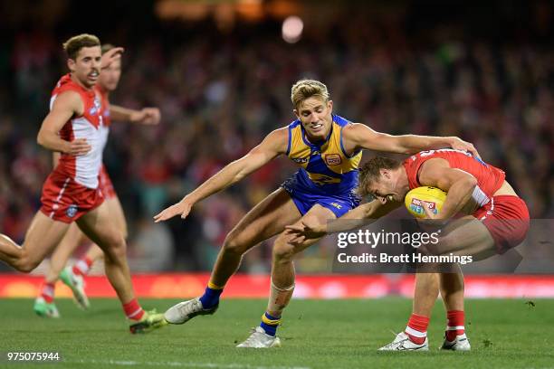 Kieren Jack of the Swans is tackled during the round 13 AFL match between the Sydney Swans and the West Coast Eagles at Sydney Cricket Ground on June...