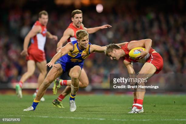 Kieren Jack of the Swans is tackled during the round 13 AFL match between the Sydney Swans and the West Coast Eagles at Sydney Cricket Ground on June...