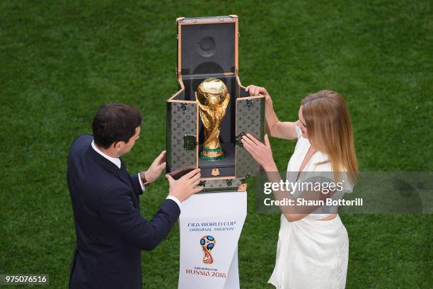 Spain legend Iker Casillas and model Natalia Vodianova show the World Cup trophy prior to the 2018 FIFA World Cup Russia group A match between Russia...