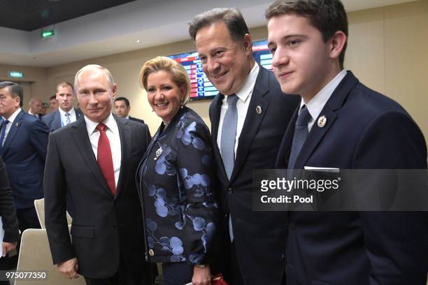President Vladimir Putin , Panama's President Juan Carlos Varela with his wife Lorena Castillo and son Adrian attend the President's Lounge during...