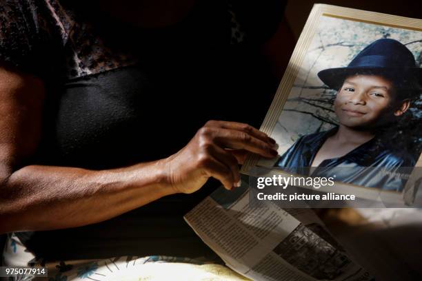 May 2018, Brazil, Rio de Janeiro: Marcia de Oliveira Silva Jacintho showing a picture of her son, Hanry Silva Gomes Ciqueira. Hanry died on 21...