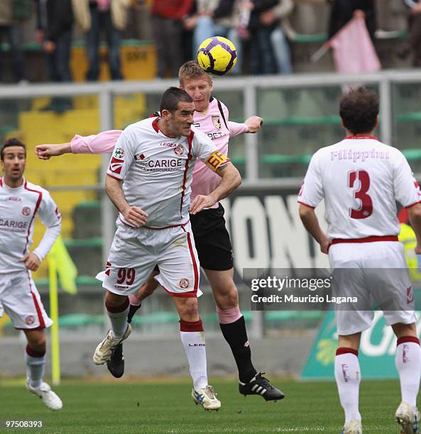 Dorin Goian of US Citta' di Palermo battles for the ball with Cristiano Lucarelli of AS Livorno Calcio during the Serie A match between US Citta di...