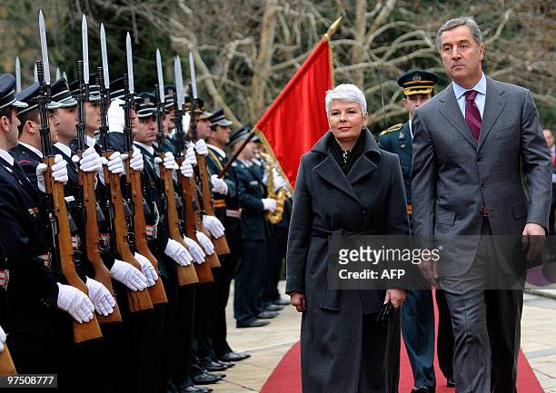 Montenegrin Prime Minister Milo Djukanovic and his Croatian counterpart Jadranka Kosor inspect a guard of honour prior their meeting in capital...