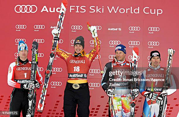 Erik Guay of Canada takes 1st place, Hannes Reichelt of Austria takes 2nd place, Aksel Lund Svindal of Norway takes 3rd place, and Tobias...