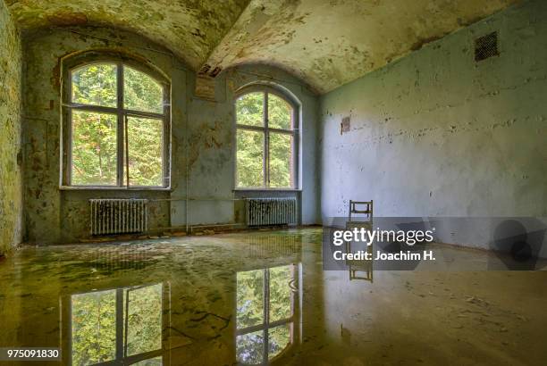 chair in abandoned house, beelitz, brandenburg, germany - beelitz stock pictures, royalty-free photos & images