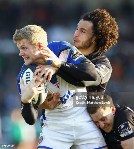 Michael Stephenson of Bath is tackled by Tane Tu'ipulotu and Jimmy Gopperth of Newcastle during the Guinness Premiership match between Newcastle...