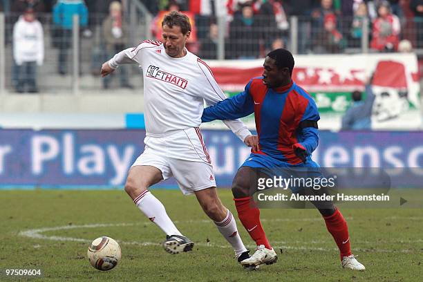 Guido Buchwald of the ran AllstarTeam battles for the ball with Jeff Lois of team Haiti during the charity match for earthquake victims in Haiti...