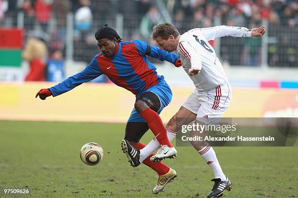Guido Buchwald of the ran AllstarTeam battles for the ball with Eliphene Cadet of team Haiti during the charity match for earthquake victims in Haiti...