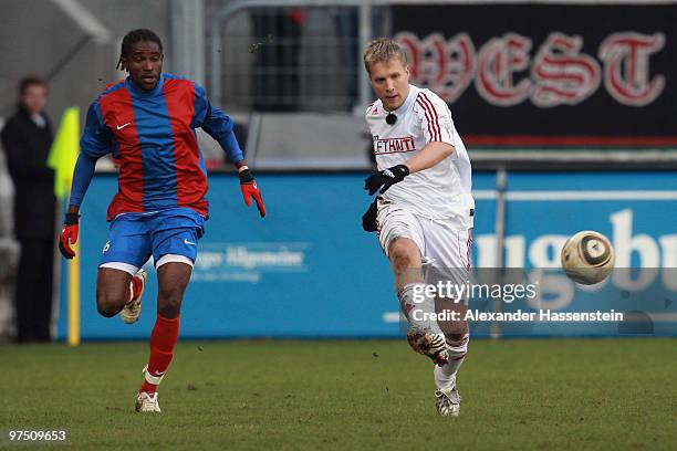 Oliver Pocher of the ran AllstarTeam battles for the ball with Raymond Ednerso of team Haiti during the charity match for earthquake victims in Haiti...
