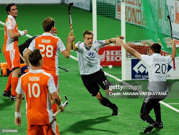 German hockey player Oliver Korn celebrates scoring the equaliser against the Netherlands during their World Cup 2010 match at the Major Dhyan Chand...