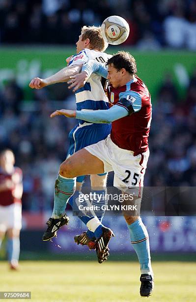 Reading's Icelandic Midfielder Brynjar Gunnarsson vies with Aston Villa's English defender Stephen Warnock during their FA Cup sixth round football...