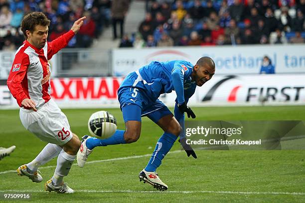 Andreas Ivanschitz of Mainz tackles Marvin Compper of Hoffenheim during the Bundesliga match between 1899 Hoffenheim and FSV Mainz at Rhein-Neckar...