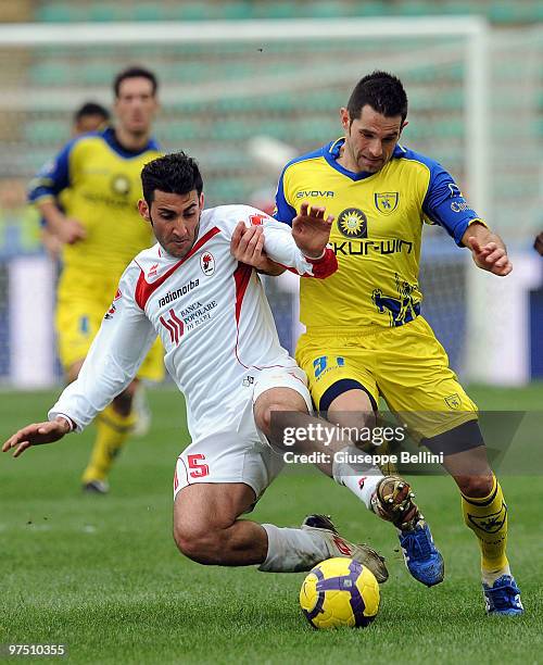 Nicola Belmonte of Bari and Sergio Pellissier of Chievo in action during the Serie A match between AS Bari and AC Chievo Verona at Stadio San Nicola...