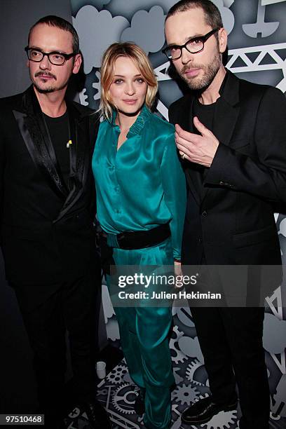 Designers Viktor & Rolf pose backstage with Carolina Crescentini during the Viktor & Rolf Ready to Wear show as part of the Paris Womenswear Fashion...