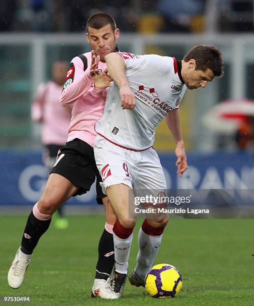 Antonio Nocerino of US Citta' di Palermo battles for the ball with Thomas Danilevicius of AS Livorno Calcio during the Serie A match between US Citta...