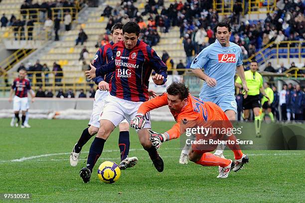 Henry Gimenez of Bologna competes with Morgan De Sanctis goal keeper of Napoli in action during the Serie A match between Bologna FC and SSC Napoli...