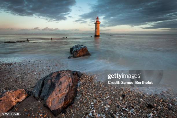 lighthouse in saint-nazaire at sunset, loire-atlantique, pays de la loire, brittany, france - saint nazaire stock pictures, royalty-free photos & images