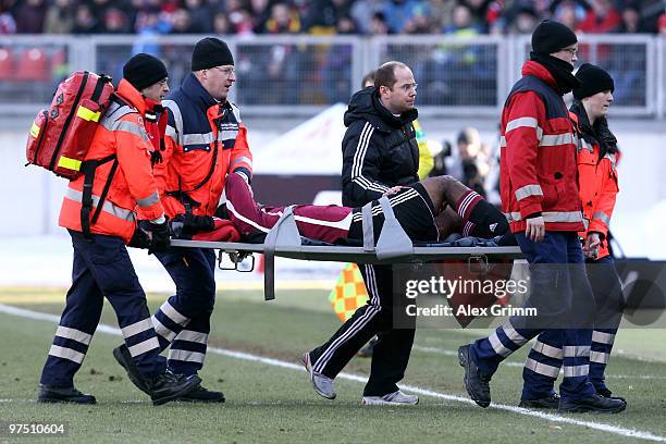 Breno of Nuernberg is injured carried off the pitch during the Bundesliga match between 1. FC Nuernberg and Bayer Leverkusen at Easy Credit Stadium...