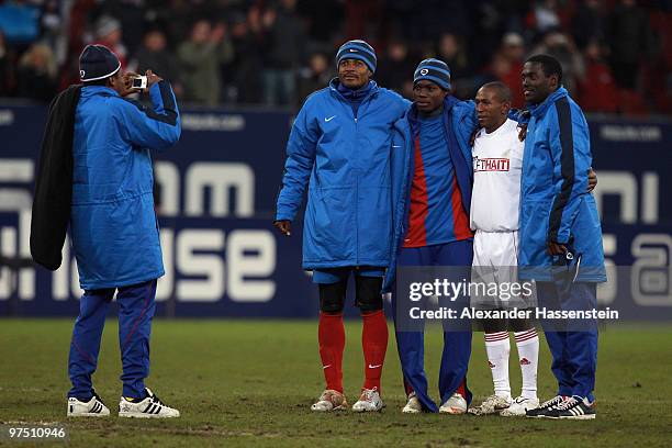 Minero of the ran AllstarTeam poses for pictures with players of team Haiti after the charity match for earthquake victims in Haiti between ran...