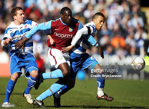 Emile Heskey of Aston Villa battles with Ryan Bertrand of Reading during the E.ON sponsored FA Cup Quarter Final match between Reading and Aston...